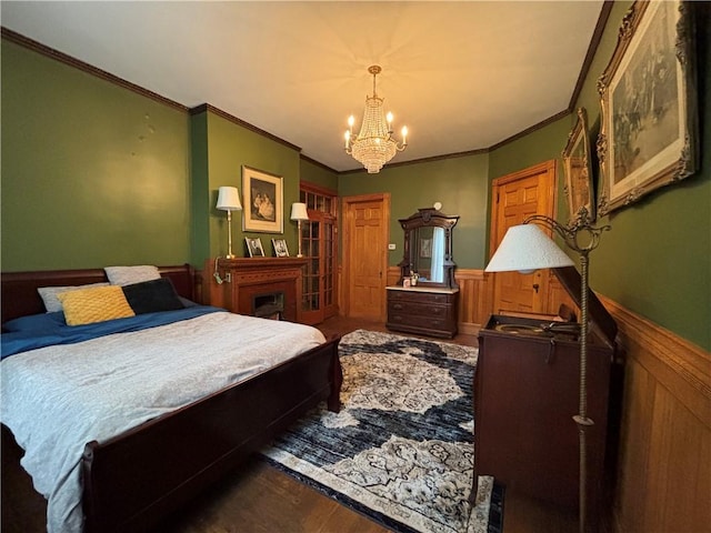 110 Edgar James St, Kane Boro, PA 16735 - bedroom with a chandelier, ornamental molding, a wainscoted wall, and wood finished floors