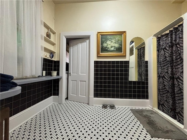 110 Edgar James St, Kane Boro, PA 16735 - bathroom with tile walls, wainscoting, and built in features