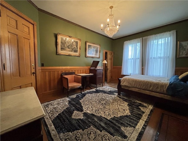 110 Edgar James St, Kane Boro, PA 16735 - bedroom featuring wood finished floors, wainscoting, a chandelier, and ornamental molding