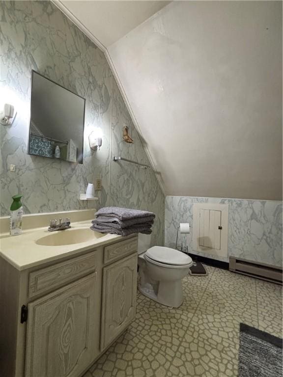 110 Edgar James St, Kane Boro, PA 16735 - bathroom featuring a baseboard heating unit, vaulted ceiling, toilet, and vanity