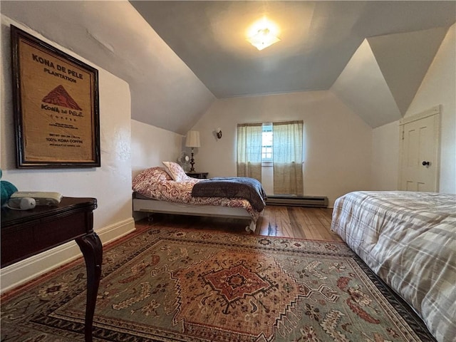 110 Edgar James St, Kane Boro, PA 16735 - bedroom with wood-type flooring, vaulted ceiling, a baseboard radiator, and baseboards