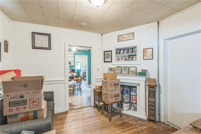 125 7th Ave, North Tonawanda, NY 14120 - interior space featuring wood finished floors, crown molding, and a wainscoted wall