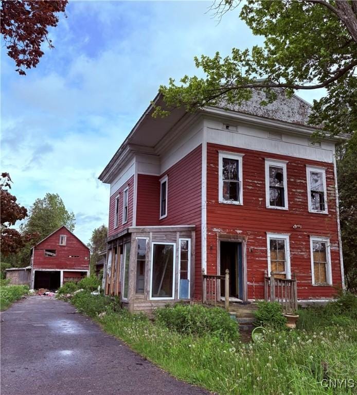129 Depot Rd, Danube, NY 13365 - view of front of property with an outbuilding and a detached garage