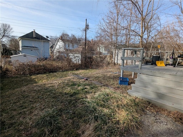 313 Ellicott St, Rochester, NY 14619 - view of yard with a wooden deck