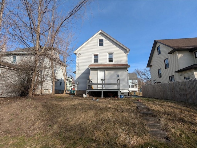 313 Ellicott St, Rochester, NY 14619 - back of house with a wooden deck