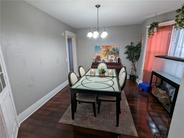 313 Ellicott St, Rochester, NY 14619 - dining room with wood finished floors, baseboards, and a chandelier