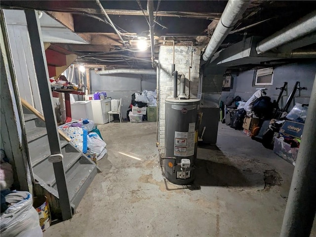 313 Ellicott St, Rochester, NY 14619 - unfinished below grade area featuring water heater and washer and dryer