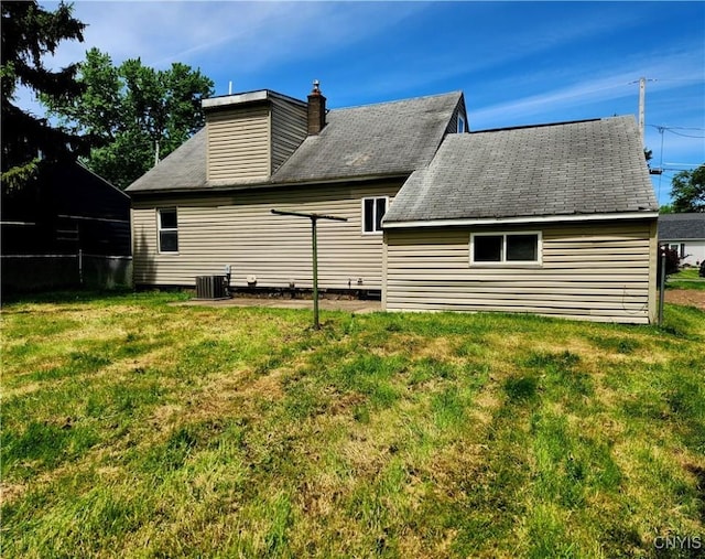 116 Kendall Dr E, Manlius, NY 13057 - back of property with central AC and a chimney
