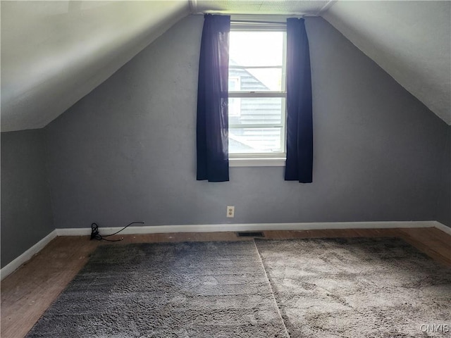 116 Kendall Dr E, Manlius, NY 13057 - bonus room with lofted ceiling, wood finished floors, plenty of natural light, and baseboards