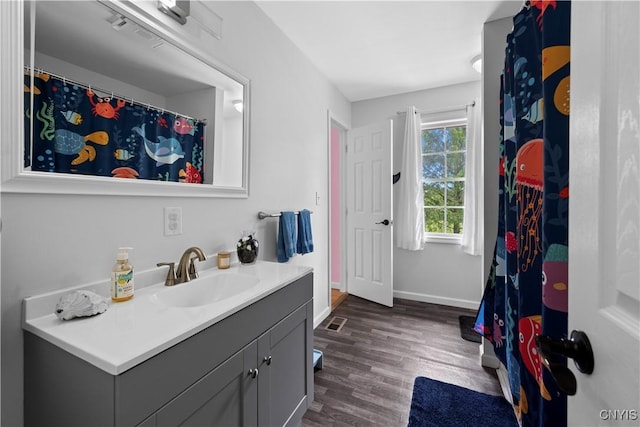 3232 Lyon Rd, Nelson, NY 13035 - bathroom featuring vanity, wood finished floors, and baseboards