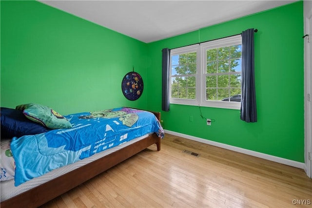 3232 Lyon Rd, Nelson, NY 13035 - bedroom featuring baseboards and wood finished floors
