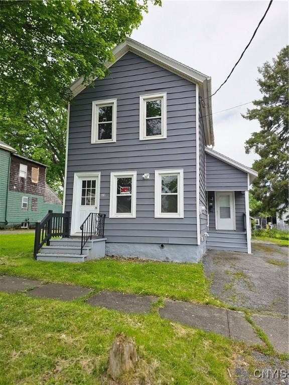 11 Bryant St, Utica, NY 13502 - view of front facade with a front lawn