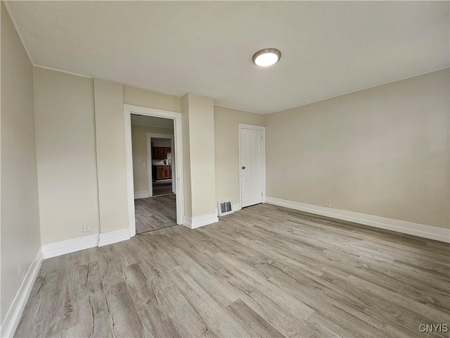 11 Bryant St, Utica, NY 13502 - empty room featuring wood finished floors and baseboards