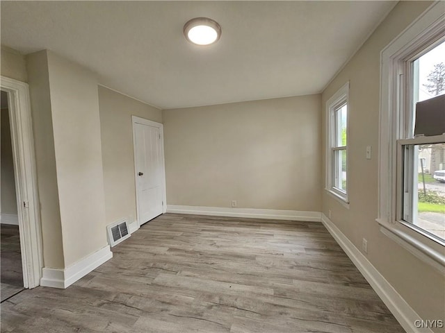 11 Bryant St, Utica, NY 13502 - unfurnished room with wood finished floors and baseboards