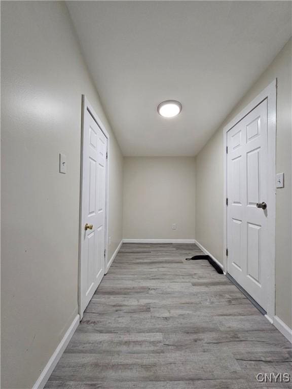 11 Bryant St, Utica, NY 13502 - corridor featuring wood finished floors and baseboards