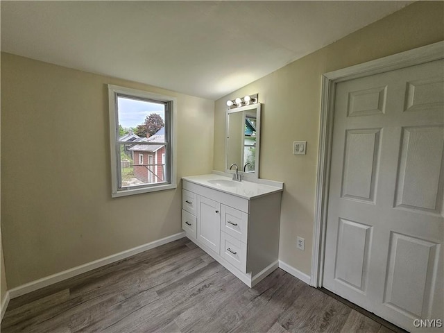 11 Bryant St, Utica, NY 13502 - bathroom featuring vanity, wood finished floors, and baseboards