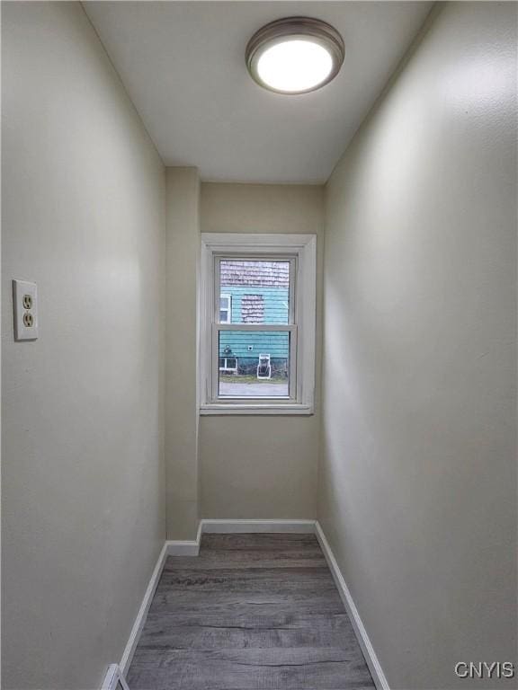 11 Bryant St, Utica, NY 13502 - hallway featuring wood finished floors and baseboards