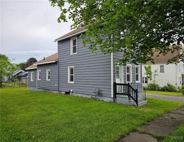 11 Bryant St, Utica, NY 13502 - view of home's exterior with a lawn