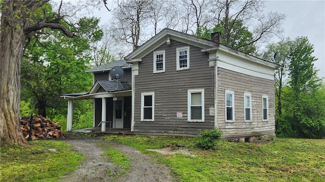 7978 Tuttle Rd, Prattsburgh, NY 14873 - view of front of home with a porch and a chimney