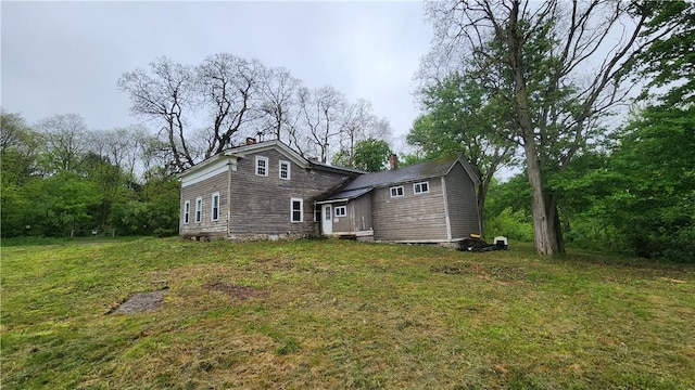 7978 Tuttle Rd, Prattsburgh, NY 14873 - back of property featuring a chimney and a yard
