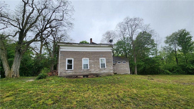 7978 Tuttle Rd, Prattsburgh, NY 14873 - back of house featuring a yard and a chimney
