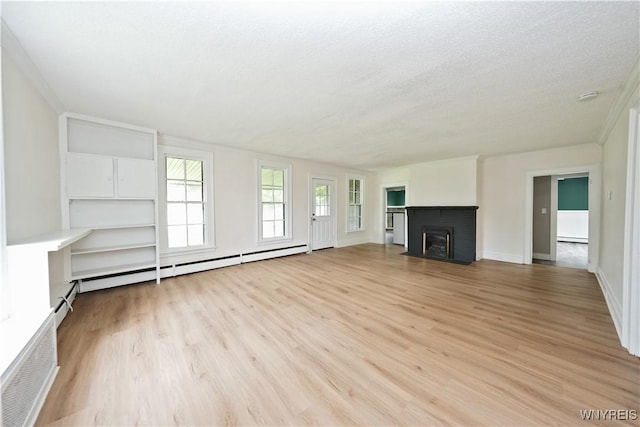 5002 Armor Duells Rd, Orchard Park, NY 14127 - unfurnished living room with light wood-type flooring, a brick fireplace, ornamental molding, a textured ceiling, and baseboard heating