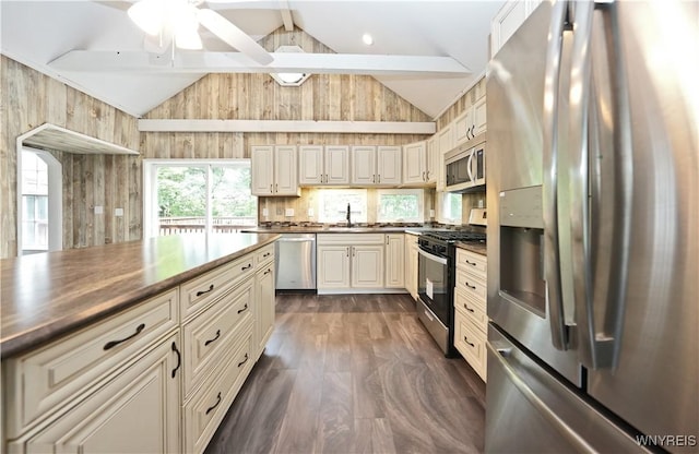 5002 Armor Duells Rd, Orchard Park, NY 14127 - kitchen with appliances with stainless steel finishes, dark countertops, dark wood finished floors, ceiling fan, and cream cabinetry
