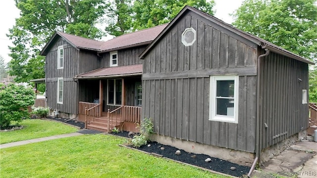 5002 Armor Duells Rd, Orchard Park, NY 14127 - view of front of property with a front lawn, board and batten siding, and a shingled roof