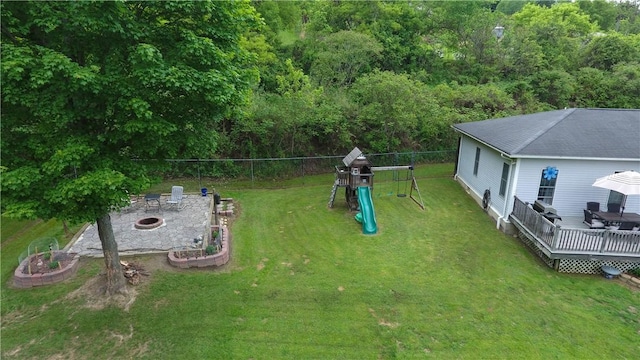 490 Bennett Pkwy, Hornellsville, NY 14843 - view of yard featuring an outdoor fire pit, a playground, and a wooden deck