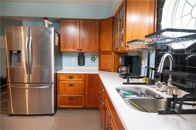 490 Bennett Pkwy, Hornellsville, NY 14843 - kitchen featuring stainless steel fridge, brown cabinets, light countertops, a sink, and tile patterned flooring
