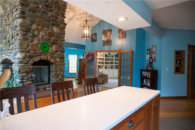 490 Bennett Pkwy, Hornellsville, NY 14843 - kitchen featuring a chandelier, brown cabinetry, dark wood finished floors, baseboards, and decorative light fixtures