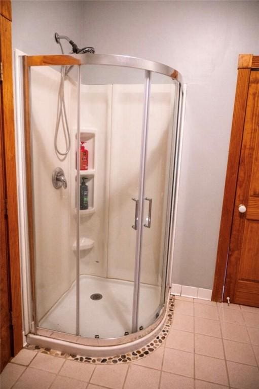 490 Bennett Pkwy, Hornellsville, NY 14843 - full bathroom featuring a stall shower and tile patterned flooring