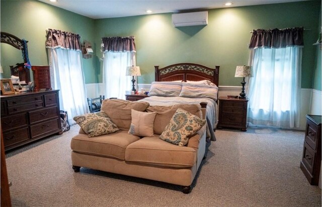 490 Bennett Pkwy, Hornellsville, NY 14843 - carpeted bedroom featuring an AC wall unit, recessed lighting, and a wainscoted wall