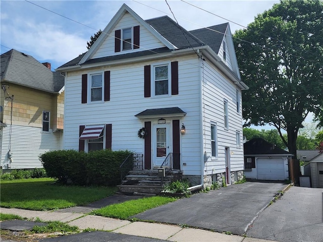 92 Nelson St, Auburn, NY 13021 - view of front of house with an outdoor structure, a garage, driveway, and a shingled roof