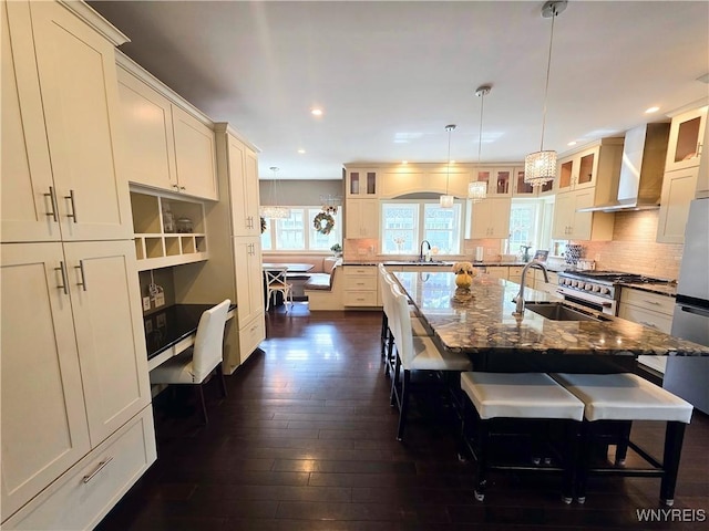 34 Maple St, Ellery, NY 14712 - kitchen featuring a sink, appliances with stainless steel finishes, dark wood finished floors, a breakfast bar, and glass insert cabinets