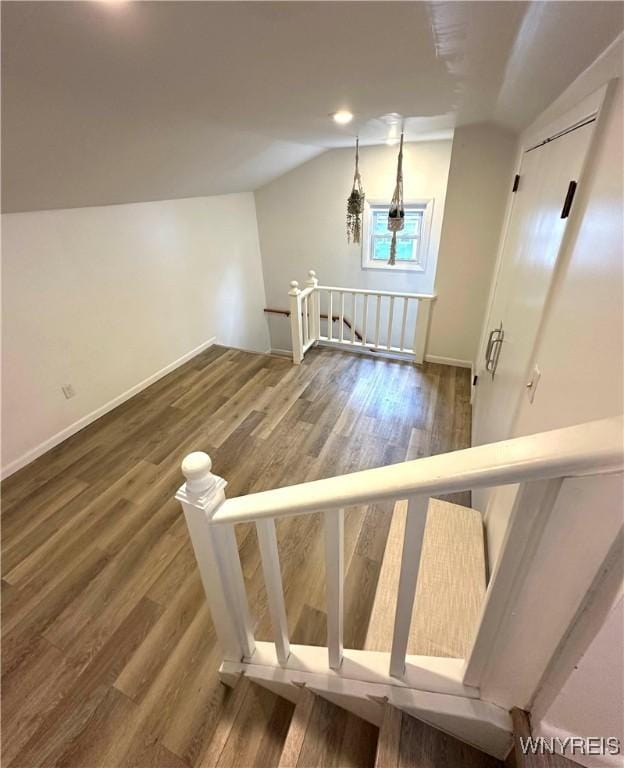 34 Maple St, Ellery, NY 14712 - stairs featuring lofted ceiling, wood finished floors, and baseboards
