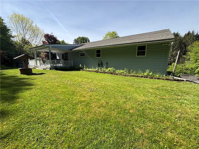 606 County Highway 12, Laurens, NY 13796 - back of property with a yard and a chimney