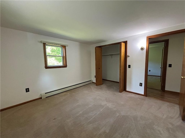 606 County Highway 12, Laurens, NY 13796 - unfurnished bedroom featuring a baseboard radiator, light colored carpet, and baseboards