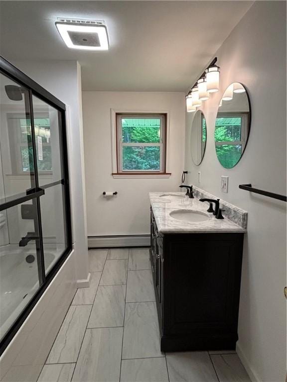 606 County Highway 12, Laurens, NY 13796 - full bath featuring a baseboard heating unit, marble finish floors, baseboards, double vanity, and shower / bath combination with glass door
