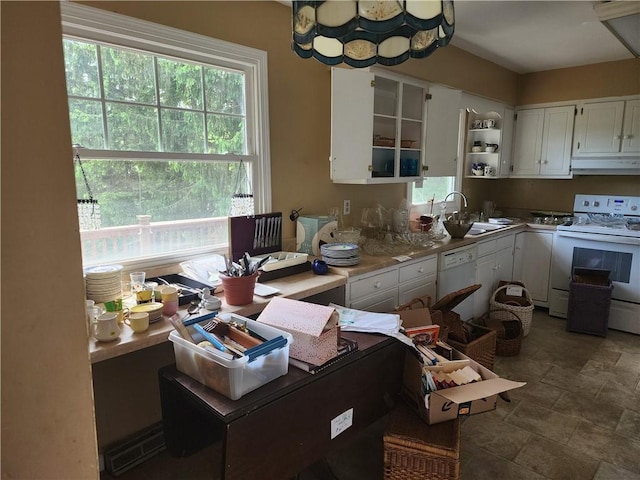 7650 Grant Avenue Rd, Sennett, NY 13021 - kitchen featuring white appliances, plenty of natural light, white cabinets, and under cabinet range hood