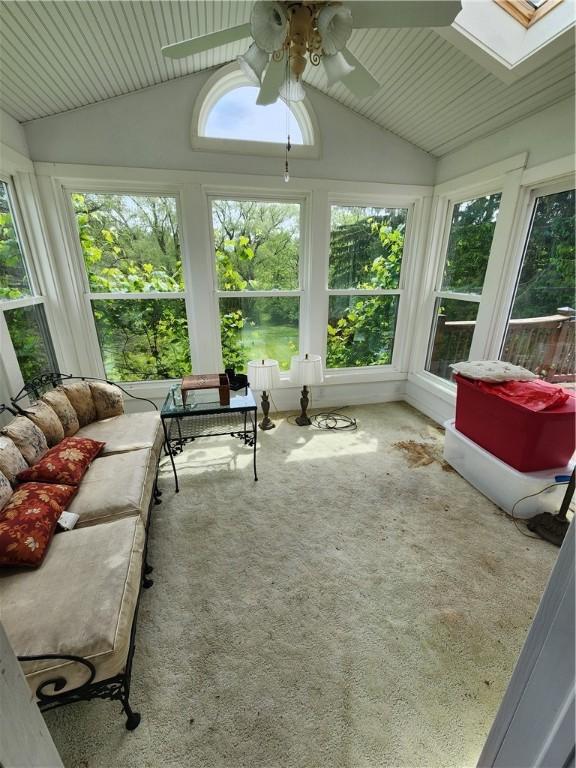 7650 Grant Avenue Rd, Sennett, NY 13021 - sunroom featuring a ceiling fan, lofted ceiling, and a skylight