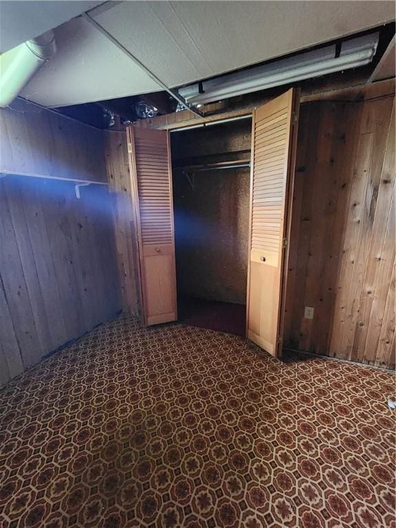 7650 Grant Avenue Rd, Sennett, NY 13021 - unfurnished bedroom featuring wood walls