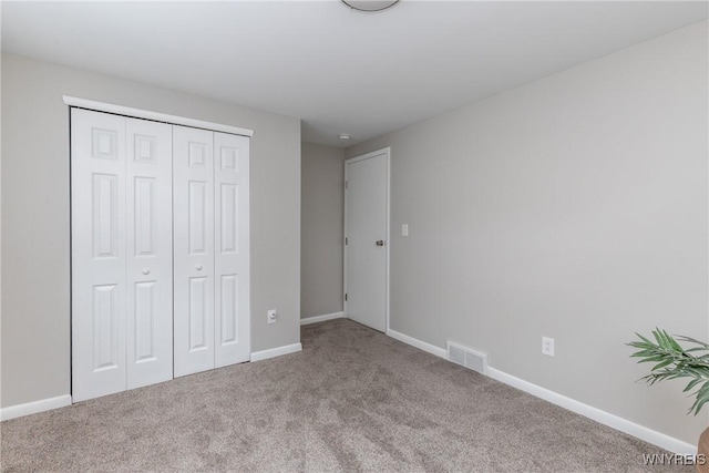 195 Robert Dr, North Tonawanda, NY 14120 - unfurnished bedroom with carpet, a closet, and baseboards