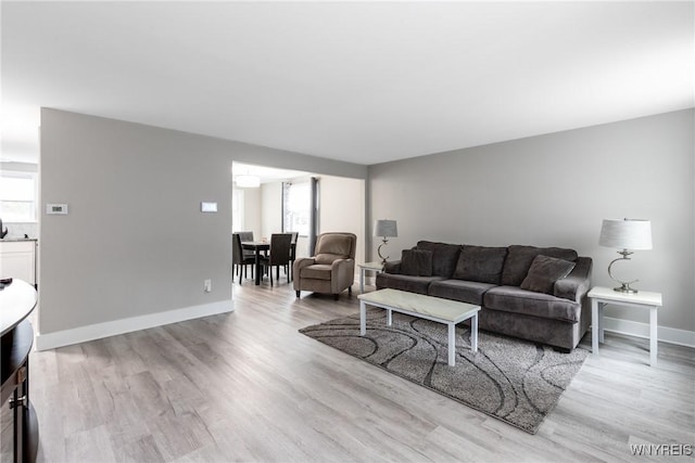 195 Robert Dr, North Tonawanda, NY 14120 - living room featuring plenty of natural light, light wood-style floors, and baseboards