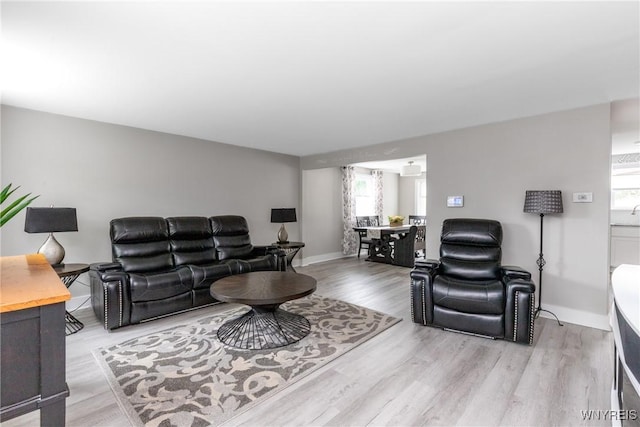 195 Robert Dr, North Tonawanda, NY 14120 - living room with healthy amount of natural light, light wood-style floors, and baseboards