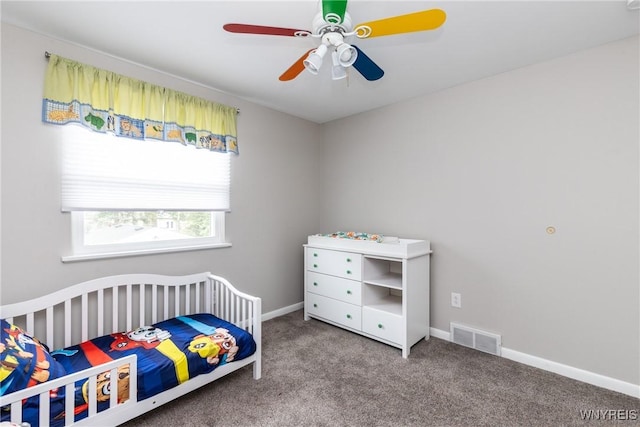 195 Robert Dr, North Tonawanda, NY 14120 - carpeted bedroom with a nursery area, baseboards, and a ceiling fan