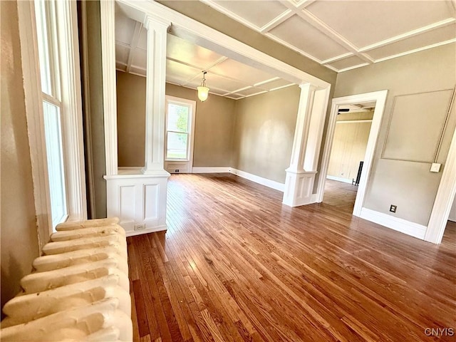 140 Maple St, Le Ray, NY 13612 - spare room featuring decorative columns, dark wood-type flooring, and baseboards