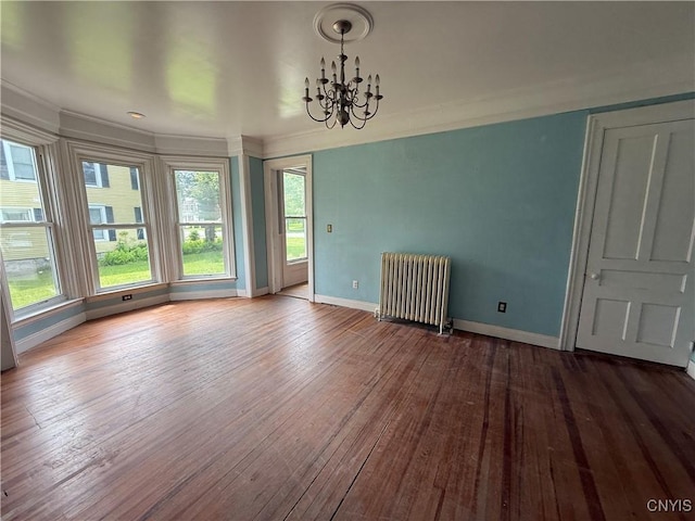 140 Maple St, Le Ray, NY 13612 - spare room with radiator heating unit, baseboards, wood-type flooring, a chandelier, and crown molding