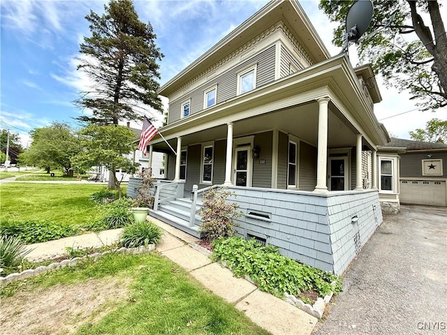 140 Maple St, Le Ray, NY 13612 - view of front of home with covered porch, a front yard, and asphalt driveway