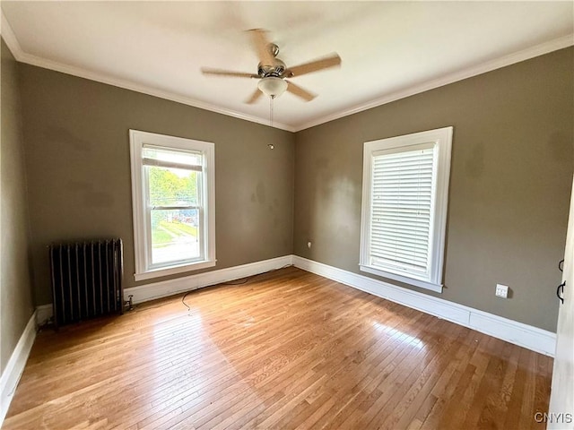 140 Maple St, Le Ray, NY 13612 - spare room with radiator, light wood-style floors, ceiling fan, baseboards, and ornamental molding